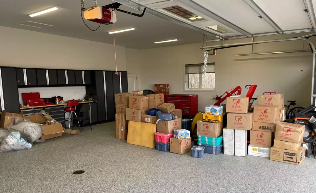 home garage filled with moving boxes and workbench